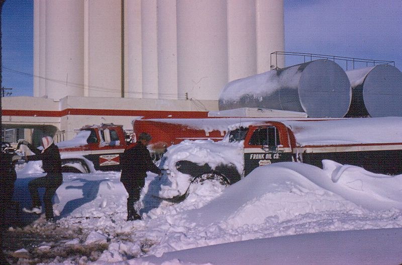 People beside a delivery truck in winter